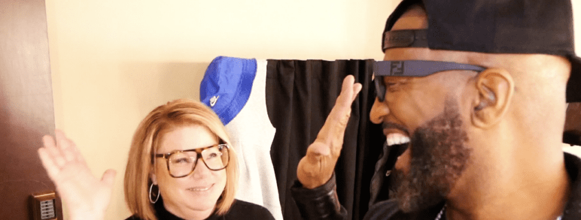 Man and woman giving each other high-five.